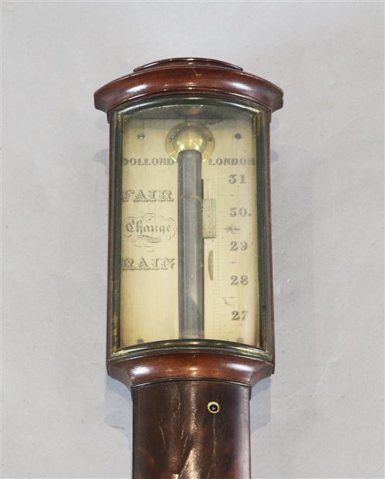 Dollond of London. A Regency mahogany bowfront stick barometer, 3ft 2in.